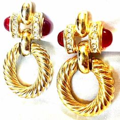 These are beautiful Gold swirled and Red Cabochon Crystal Hoop clip ons. These are very trendy and nice. They would make an awesome gift.They are vintage and in good shape Red Clip-on Earrings For Formal Occasions, Elegant Red Metal Hoop Earrings, Vintage Clip-on Hoop Earrings For Party, Retro Red Clip-on Earrings For Formal Occasions, Red Costume Jewelry Earrings For Formal Occasions, Red Formal Costume Jewelry Earrings, Vintage Red Drop Clip-on Earrings, Red Vintage Style Drop Clip-on Earrings, Vintage Red Clip-on Earrings For Evening