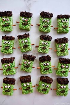 there are many green treats with eyes on them