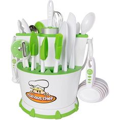 the green and white kitchen utensils are organized in a cup with spoons