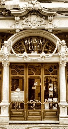 an old fashion store front with mannequins in the windows and ornate architecture