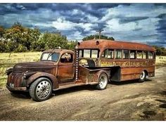 an old rusted out bus parked on the side of a dirt road with trees in the background