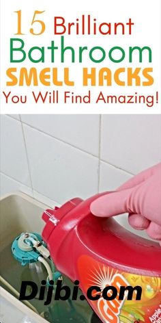 a hand in pink gloves is cleaning a sink with a red sprayer and soap