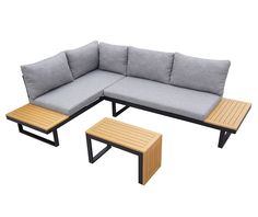 an outdoor sofa and coffee table set with cushions on the top, in front of a white background