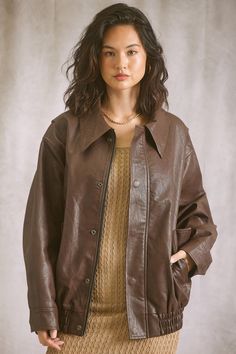 An Oversized Leather Bomber? Yes please! The Details: Cool girl fall is here and you need this Dark brown vegan leather jacket to complete every outfit. What Is Trending Now, Long Sleeve Tank Top, Vegan Leather Jacket, Fall Is Here, Girl Falling, Girl Top, Dress Romper, Bottoms Pants, Short Tops