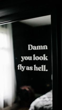 a mirror with the words damn you look flyas hell