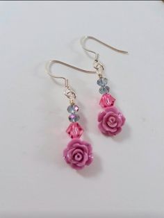 These simple drop/dangle earrings have a pink resin rose and crystal and glass beads above for some added sparkle! Nice Wardrobe, Jewelry Earings, Resin Rose, Wire Wrapped Jewelry Tutorials, Diy Jewelry Unique, Spring Earrings, Earring Ideas, Jewelry Accessories Ideas, Crystal Dangle Earrings