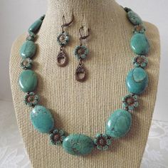 "Polished turquoise stones and brushed copper beading are a beautiful match in this bold necklace set. The puffed turquoise stones measure an inch each and are enchanced with the copper finish on the czech glass. This necklace is 19\" and the corrdinating earrings are 2\" on copper leverback wire.  All orders come in a beautiful gift box ready for giving along with a special \"thank you\" gift . Thank you for sharing my love of jewelry." Turquoise Beaded Copper Jewelry, Turquoise Patina Copper Jewelry, Brushed Copper, Bold Necklace, Turquoise Stones, Copper Finish, Beautiful Gift Boxes, 2 On, Turquoise Stone