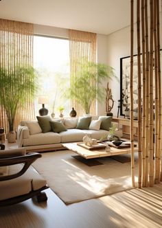 a living room filled with lots of furniture next to tall bamboo poles and plants in vases