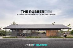 a small building with people walking around it and the words the rubber rr above it