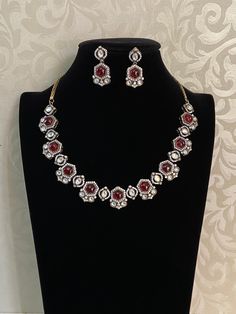 This exquisite Victorian-style ad necklace showcases intricate craftsmanship, blending traditional Indian and Victorian elements. Traditional White Jeweled Necklace, Jeweled Round Necklaces For Festivals, Exquisite Round Necklaces For Festive Occasions, Elegant Bridal Pendant Necklace With Stone Work, Elegant Bridal Necklace With Stone Work Pendant, Elegant Necklace With Stone Work For Festive Occasions, Elegant Kundan Jeweled Necklaces, Elegant Pendant Kundan Necklace For Festive Occasions, Formal Round Necklaces For Diwali