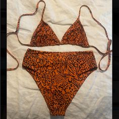 Kulani Kinis Animal Oasis Bikini Set. The Bottoms Are High Waisted And Have A Great Coverage. Both Are A Size Medium And Brand New! Orange Tie-side Bottom Swimwear For Poolside, Orange Tie-side Swimwear For Pool, Orange Tie-side Bottom Swimwear For Swimming, Orange Tie-side Bottom Swimwear For Summer, Orange Tie-side Swimwear For Summer, Orange Tie-side Swimwear, Fitted Swimwear With Bold Print For Sunbathing, Summer Orange Tie-side Bottom Swimwear, Fitted Orange Tropical Print Swimwear