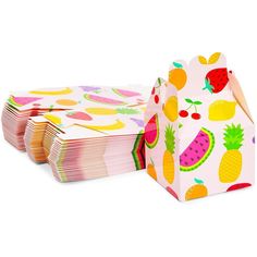 paper bags with fruit designs are stacked on top of each other in front of a white background