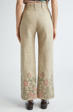 A Victorian-era travel bag provided the trumpetflower embroidery pattern growing from the hems on these pants cut from richly textured, breathable linen. 29" inseam; 20 1/2" leg opening; 12" front rise; 15 1/2" back rise (size 27) Zip fly with hook-and-bar closure Front welt pockets Lined 100% linen Dry clean Imported Designer Clothing Spring Wide Leg Bottoms With Resham Embroidery, Summer Linen Bottoms With Floral Embroidery, Bohemian Embroidered Beige Bottoms, Traditional Linen Straight Pants, Spring Embroidered Wide-leg Pants, Beige Floral Embroidered Pants, Embroidered Linen Wide-leg Bottoms, Trouser Embroidery, Embroidered Trousers