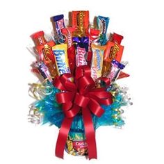 a bouquet of candy wrapped in red ribbon