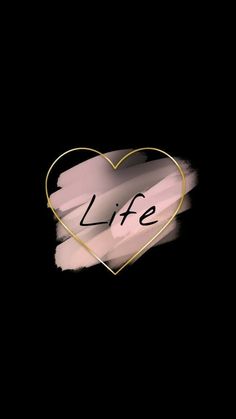 a heart with the word life written on it in gold and black ink against a dark background