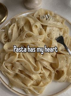 pasta has my heart written on it with a fork in the plate next to it