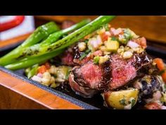 steak and vegetables on a plate with sauce