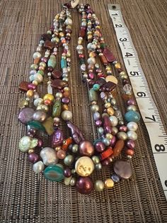 Multicolor Beaded Long Necklace, Unique Multicolor Beaded Long Necklace, Bohemian Multicolor Pearl Necklace With Gemstone Beads, Multicolor Bohemian Pearl Necklace With Gemstone Beads, Long Colorful Beaded Costume Necklace, Multicolor Multi-strand Costume Jewelry Beads, Multicolor Polished Beads For Costume Jewelry, Multicolor Polished Bead Costume Necklace, Multicolor Large Beads Costume Jewelry Necklace