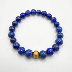 Lapis Lazuli Gemstone Crystal Bracelet, Beaded Bracelet Chakra Healing, Gold Charm Stone Bracelet, Mens Womens Bracelet, Lapis Jewelry 💫 Lapis Lazuli Gemstone Energy Bracelet 💫 Details: ✨8mm Natural Lapis Lazuli Gemstone Beads ✨Gold Secrets of KOSHA Signature Charm Lapis Lazuli Lapis Lazuli is one of the most sought-after stones used since the beginning of human existence. Its rich, heavenly blue colour continues to be a representation of majesty and honour, deities and strength, spirit and vision. It is a universal representation of knowledge and reality. A potent gemstone for opening the higher consciousness and boosting intelligence is lapis lazuli. It encourages the pursuit of knowledge, clarity, and understanding and facilitates learning. It works wonders to improve memory. Addition Luxury Lapis Lazuli Gemstone Beaded Bracelets, Luxury Lapis Lazuli Bracelet, Blue Lapis Lazuli Spiritual Crystal Bracelet, Hand-strung Lapis Lazuli Bracelets For Meditation, Hand-strung Lapis Lazuli Spiritual Bracelets, Human Existence, Lapis Jewelry, Womens Bracelet, Lapis Lazuli Gemstone