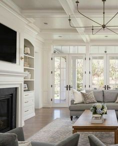 a living room filled with furniture and a fire place