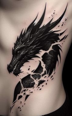 a woman's chest with a black dragon tattoo on it