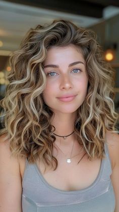 Naturally Curly Brunette Hair, Curly Mom Hairstyles, Womens Perms 2024, Bronde Balayage Natural Curls, Balayage Curly Hair Natural Curls Dark Brown Blonde, Loose Perms For Medium Length Hair, Mid Length Haircut For Curly Hair, Natural Curly Long Bob, Curly Hair For Long Face Shape