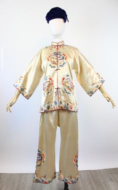 "Stunning 1940's lingerie set that can certainly be worn out as a two piece set or separately! Jacket is done in the most exquisite ivory silk and hand embroidered with dragons and roosters and rainbow shapes at the hem. Frogs to button up, wide sleeves and lined in ivory silk. Wide leg drawstring pants are embroidered also. Brand: unknown Size on tag: None Fits like: small/medium Color: ivory/multi Material: silk Condition: Excellent Vintage: a few faint marks here and there on the pants, see l Chinese Pants, Wide Leg Drawstring Pants, Chinese Silk, Ivory Silk, Rayon Dress, Silk Jacket, Knit Set, Wide Sleeves, Drawstring Pants