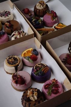 four boxes filled with different types of desserts