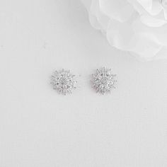 Sparkly Sun Flower Stud Earrings in Cubic Zirconia Sparkly Flower stud earrings Ruth is made with sparkly cubic zirconia in a sunflower design and is gorgeous to wear on any occasion and on your wedding day. Suitable with any outfit, can gift it to your loved ones, it is nice, bright, and sparkly with any outfit. Measurement:- measures 1 inch or 2.54 cm approximately. Sunflower Designs, Poetry Design, Flower Stud Earrings, Sunflower Pattern, Matching Jewelry, Flower Stud, Sunflower Design, Flower Earrings Studs, Crystal Flower