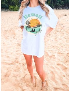 Get ready to be obsessed with your new Forever Hawaii Beach scene   Comfort Colors T-shirt the perfect way to emit those all-important Beachy vibes with a Retro feel * Q U I C K * F A C T S * .:Comfort Colors t-Shirt .: 100% ring-spun cotton .: Medium fabric (6.1 oz/yd² (206.8 g/m .: Relaxed fit .:Sewn-in twill label .:Care Instructions Machine wash: cold (max 30C or 90F); Do not bleach; Tumble dry: low heat; Iron, steam or dry: low heat; Do not dryclean. .:S I Z I N G * ✺ ✺ Sizing is unisex so runs like men's, though not overly large ✺ Most women find their typical size works best since they are meant to fit a touch loose ✺ Size guide and fit: please see the size chart in the images. Before ordering * S H I P P I N G * T I M E S * ✺ Our items are individually made with love for each of ou White Printed T-shirt For Day Out, Casual Crew Neck T-shirt For Vacation, Tropical Graphic Print T-shirt For Beach, Casual Palm Tree Print Tops For Day Out, Casual White T-shirt For Vacation, White Tropical T-shirt For Beach Season, Short Sleeve Printed T-shirt For Day Out, Beach Graphic Tee T-shirt With Print, Vacation Graphic Print Short Sleeve T-shirt