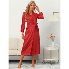 Indulge in effortless elegance with this stunning satin pajama robe, featuring intricate lace detailing and a sophisticated midi-length silhouette. Elevate your bedtime routine with the luxurious feel of this satin robe, adorned with intricate lace accents and a versatile long-length design. The silky satin fabric drapes fluidly over the body, with delicate lace trim that adds a touch of femininity and romance. The length of the robe is generally above the ankle, comfortable and versatile for ma White Satin Nightgown For Wedding Night, Elegant Solid Satin Sleepwear, Solid Color Satin Sleepwear, Red Satin Nightgown For Wedding Night, Red Satin Dress For Loungewear, Red Satin Sleepwear For Pajama Party, Elegant Red Sleepwear For Wedding Night, Lace Trim Long Sleeve, Satin Pajama