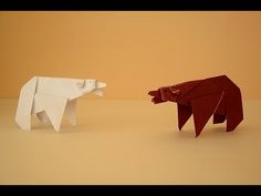 two origami animals facing each other in opposite directions