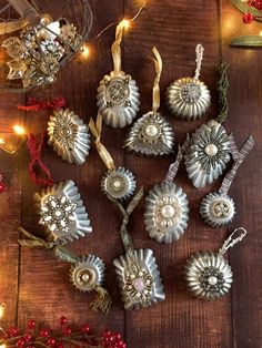 christmas ornaments are laid out on a wooden table