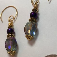 "HANDMADE Crystal ab Earrings   APPROX LENGTH:  1.75\"  EARWIRE:  Hook & Loop COLOR : Purple on Gold Hook  Ear wire Loop & Hook MATERIALS:   Crystals,  filigree bead caps, misc beads, spacers, flowers." Crystal Jewelry Diy, Beaded Earrings Diy, Purple Beads, Beads Earrings, Great Gifts For Mom, Crystal Ab, Bead Caps, Diy Earrings, Crystal Jewelry