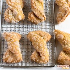 several pastries are cooling on a wire rack