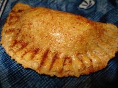 a piece of food sitting on top of a blue cloth