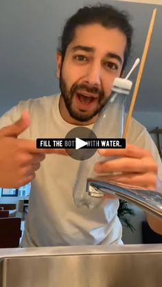 a man holding a toothbrush in front of a sink with the words fill the pot with water