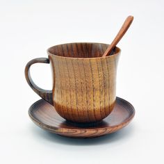 a wooden cup and saucer on a plate