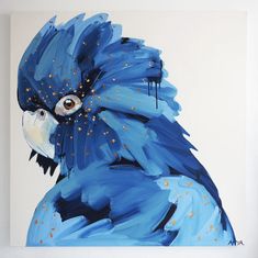 a painting of a blue parrot with gold dots on it's feathers and eyes