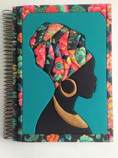 a notebook with an image of a woman's head on it