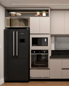 a modern kitchen with stainless steel appliances and black counter tops