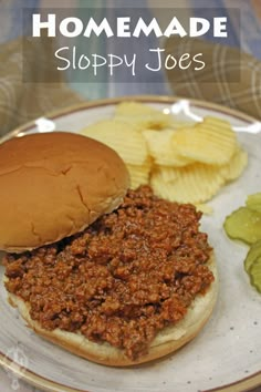 a sloppy joe sandwich on a plate with chips