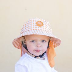 The OG is back baby!! We're bringing back Season Ones favourite Style - the Orange Gingham Plow Hat. This hat comes in XS, S, M, & XLWe've got toddlers, kids, teens, men, women / adults coveredRefer to Size Guide All Surf Hats come WITH the legionnaires, not separately. We want to provide you with all the tools to keep you sun safe every surf - you may choose to go with or without it at your own risk after purchase. Features: recycled nylon outer wide brim bucket firm front half brim netted lining - reduces slipping dual tightening mechanism water escape panel soft neoprene chin strap optional: legionnaires flap Colour: Orange + Beige Playful Adjustable Hats With Upf 50+, Playful Sun Hat With Upf 50+ And Adjustable Fit, Playful Bucket Hat With Uv Protection, Playful Sun Hat With Uv Protection And Adjustable Fit, Playful Adjustable Cotton Hat, Playful Cotton Hat With Adjustable Fit, Playful Adjustable Sun Hat With Uv Protection, Adjustable Brimmed Sun Hat For Playtime, Adjustable Fit Hats With Upf 50+ For Playtime