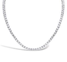 This exquisite tennis necklace features 150 dazzling diamonds, gracefully set in 14K white gold. The diamonds whirl around the necklace in a continuous loop, creating a stunning display of elegance and sparkle. Perfect for making a statement at any occasion, this necklace combines classic sophistication with modern allure. Timeless White Tennis Necklace With Single Cut Diamonds, White Timeless Tennis Necklace With Single Cut Diamonds, White Platinum Tennis Necklace With Diamond Accents, Timeless White Brilliant Cut Tennis Necklace, Wedding Tennis Necklace In White Gold Platinum, White Gold Platinum Tennis Necklace For Wedding, Dazzling Platinum Tennis Necklace For Wedding, Elegant White Platinum Tennis Necklace, White Diamond Single Strand Tennis Necklace