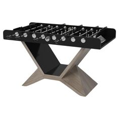 a black table top foosball with silver knobs on the sides and legs