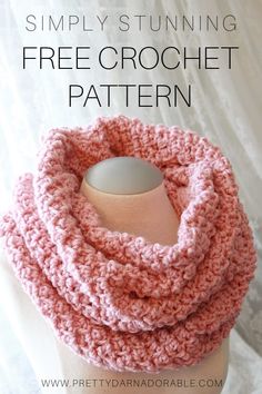 a pink crochet cowl with text that says simply turning free crochet pattern