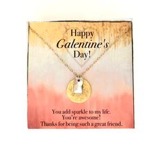 a happy valentine's day card with a heart shaped pendant and message on it