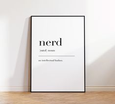 a black and white poster with the words nerd on it in an empty room