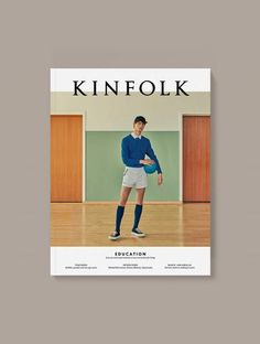 the cover of kinfolk magazine featuring a man in blue shirt and white shorts