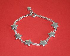 a simple bracelet made by thick silver plated Zamak connected by five stars or Pentagrams, closed by lobster closure. Adjustable size design. Please measure your wrist's size correctly, we will adjust the bracelet size based on your wrist size. Style: vintage , unique , special.... Net weight: less than 50g Package: simple package. Star-shaped Metal Bracelets As Gifts, Silver Star Charm Bracelet Gift, Metal Chain Bracelet With Star Charm As Gift, Silver Adjustable Chain Bracelet With Star Charm, Adjustable Silver Chain Bracelet With Star Charm, Handmade Silver Star Bracelets, Silver Chain Bracelet With Star Charm As Gift, Handmade Silver Star Bracelet, Nickel-free Silver Star Bracelet